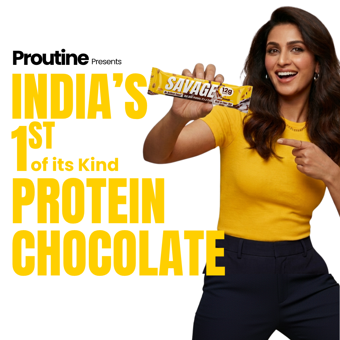 A woman in a yellow top and dark pants holds up a Proutine Savage protein chocolate bar against a white background with bold yellow text reading 'INDIA'S 1st of its Kind PROTEIN CHOCOLATE.'.